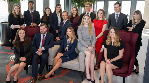 a group of trainees from our summer placement scheme gathered in the vista lounge of Hugh James' 2 Central Square Cardiff office