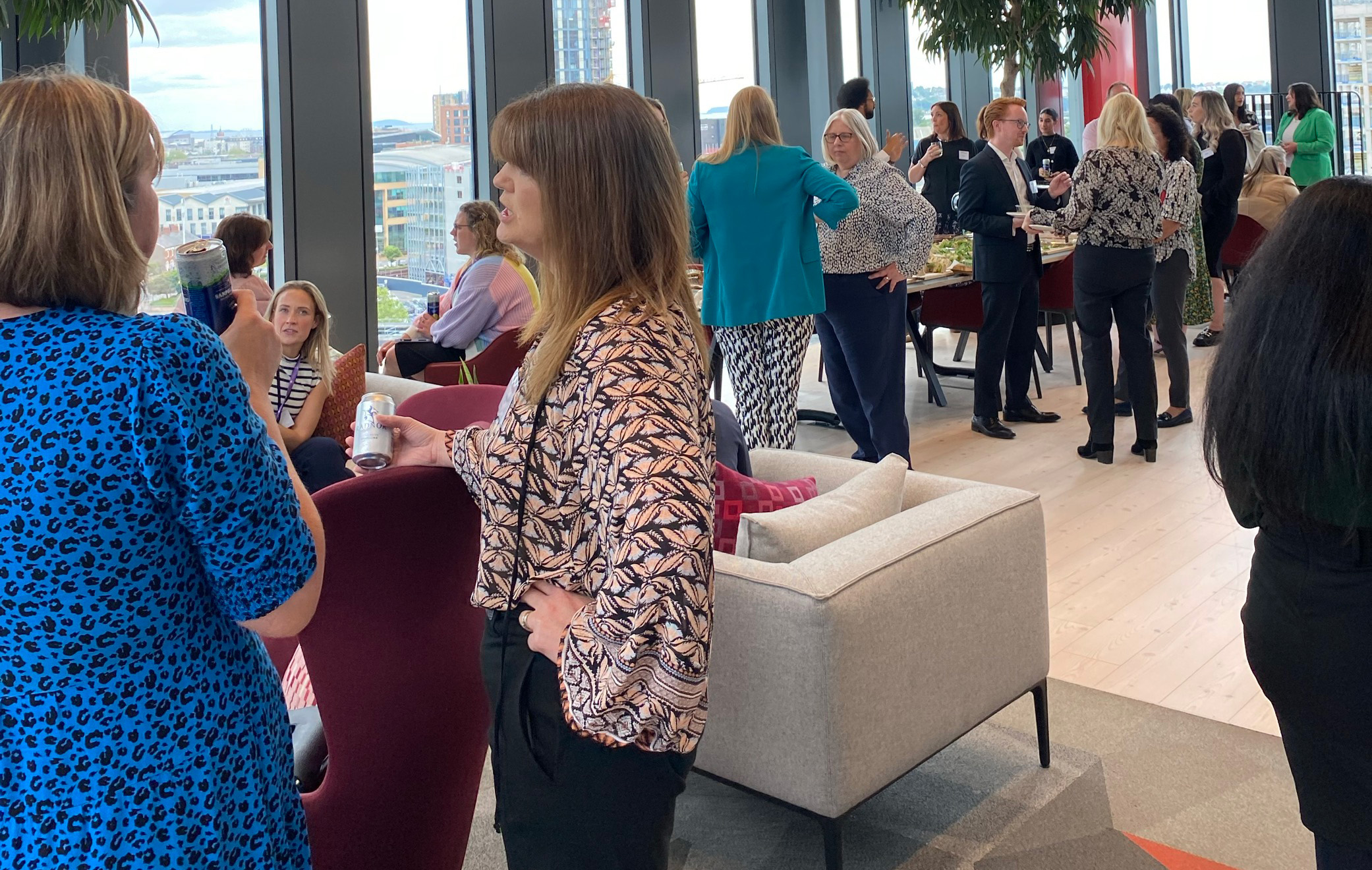 Attendees of the the NatWest "Powering up your future" event held at the Hugh James 2 Central Square headquarters gather in the office's Vista longue for drinks and a buffet
