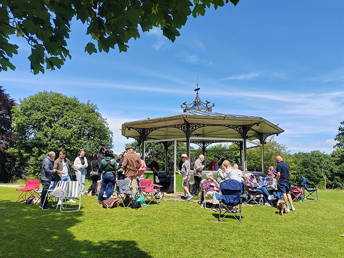 Anna Burns and members of Action Mesothelioma Day with MESothelioma Support Yorkshire (MESSY) on a sunny day gather for a picnic at the bandstand in Roundhay Park, Leeds.