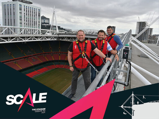 Left to Right: Construction Partner Iwan Jenkins, Construction Partner Matthew Stevens, and Director of Business Division Ioan Prydderch walk around Principality Stadium’s rooftop wearing harnesses clipped to railings as part of SCALE's launch event.